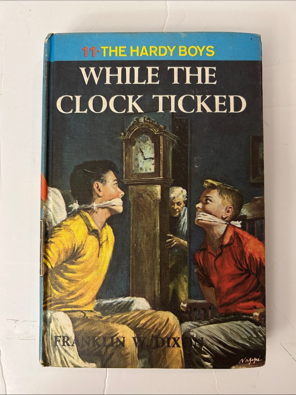 Hardy boys book While the Clock Ticked - Classic Mystery Hardcover 1962